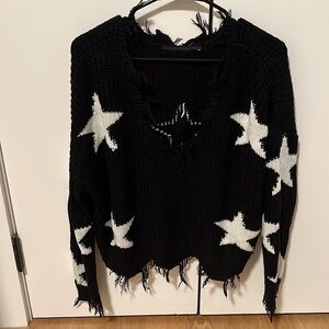 Star shirt with fringe on the bottom. Knit material but not too hot. Not itchy
